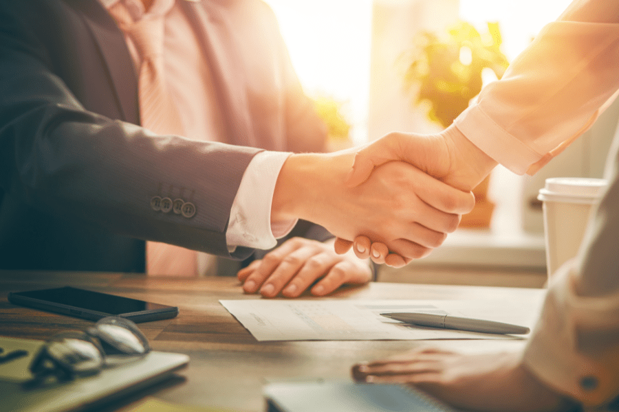 a man and a woman shaking hands