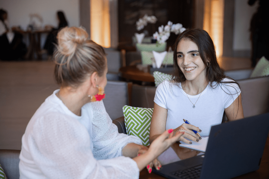 two female HR colleagues discussing hiring in Europe