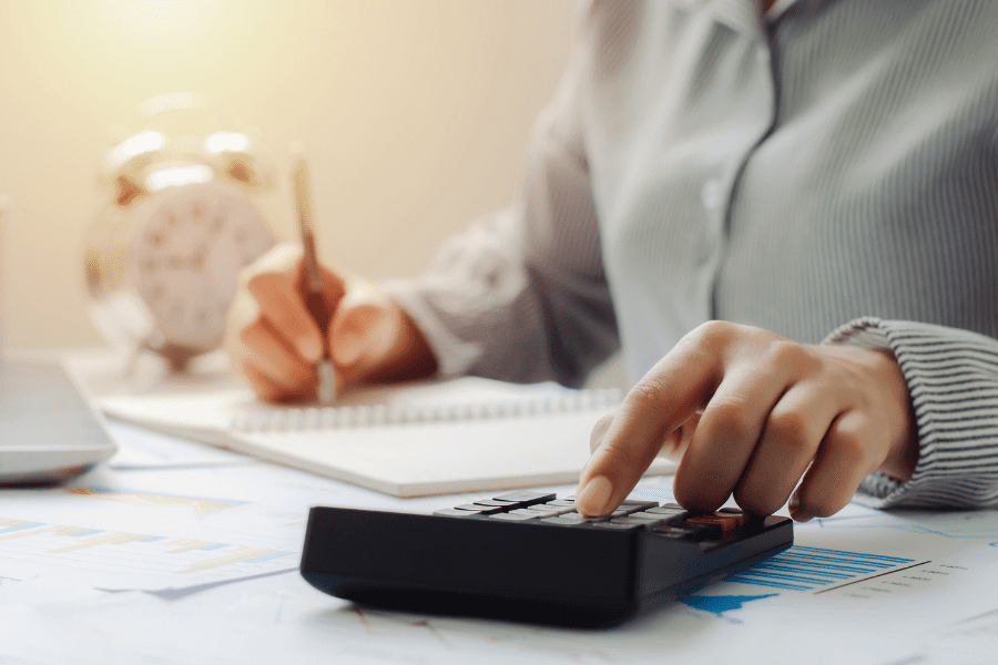 an employee in Japan calculating tax benefits using a calculator