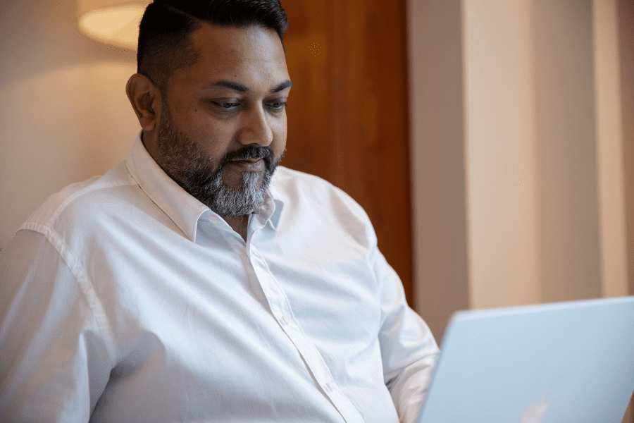 an African employee working remotely on a laptop