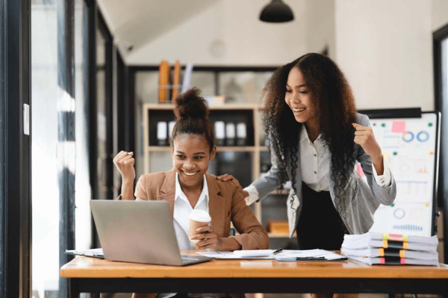 two colleagues working together on laptop