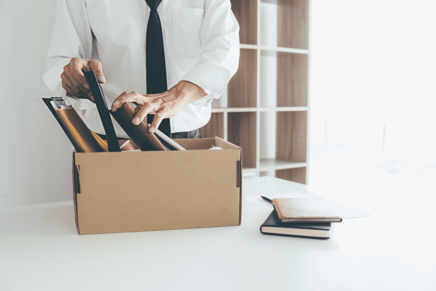 an employee packing his belongings after being terminated