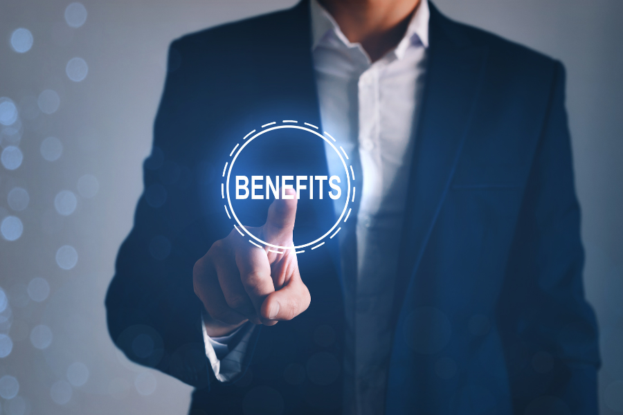 Employee pressing a digital button named benefits to show Compliant Benefits